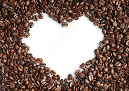 Coffee beans heart shaped frame on white