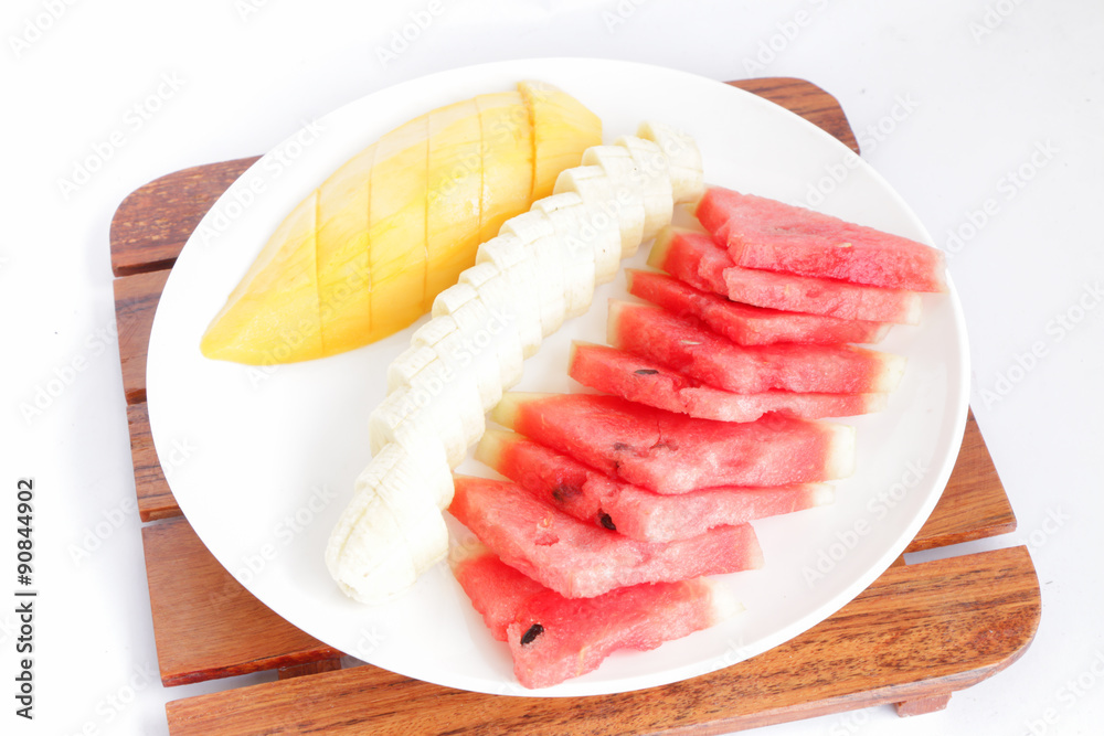 slice fruits (bananas and watermelon) put on plate