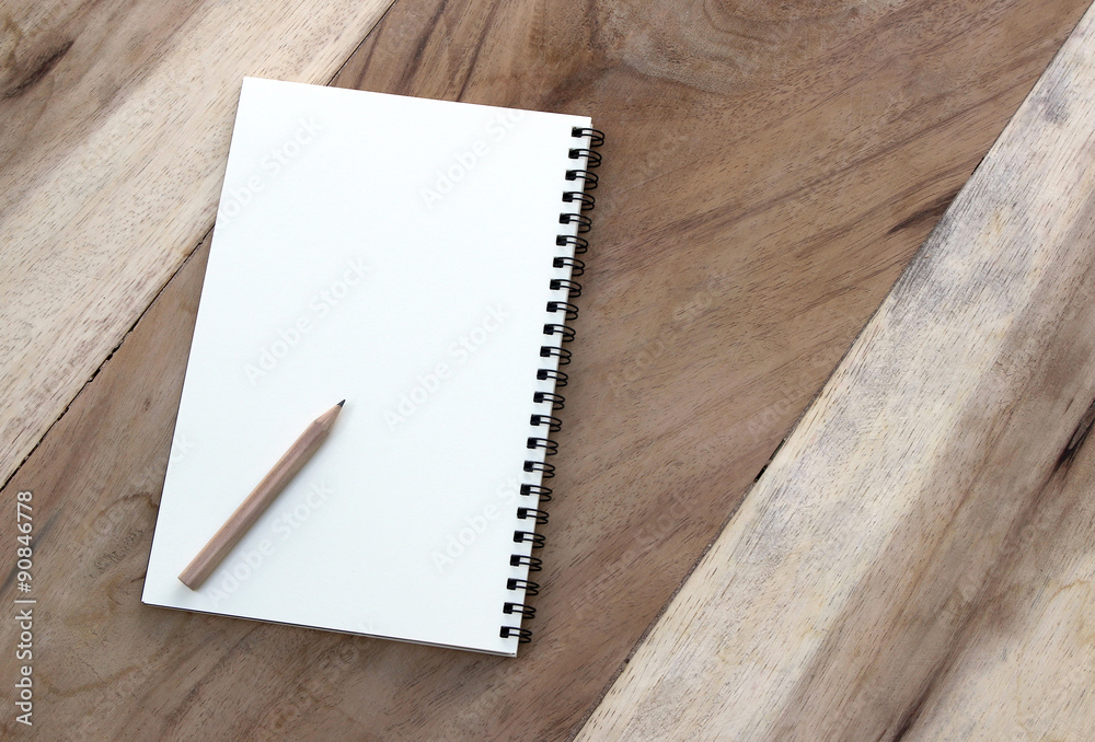 notebook and pencil on old wood table notebook and pencil on old wood table