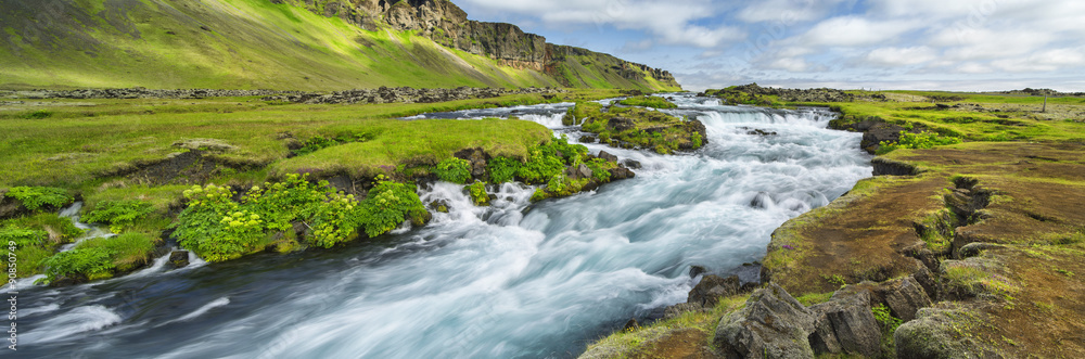 Power river with strong current in Iceland Power river with strong current in Iceland