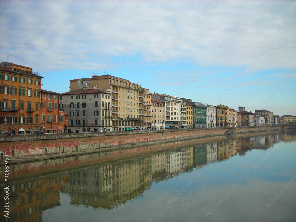 Beautiful renaissance architecture of Pisa on the banks of river Arno on a sunny, tranquil morning. Italy, Tuscany.