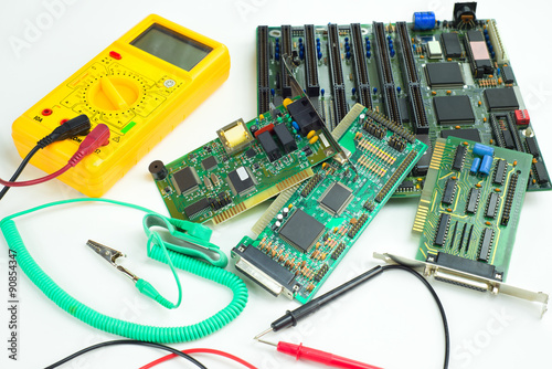 Digital clamp meter, antistatic wrist strap and computer circuit boards
