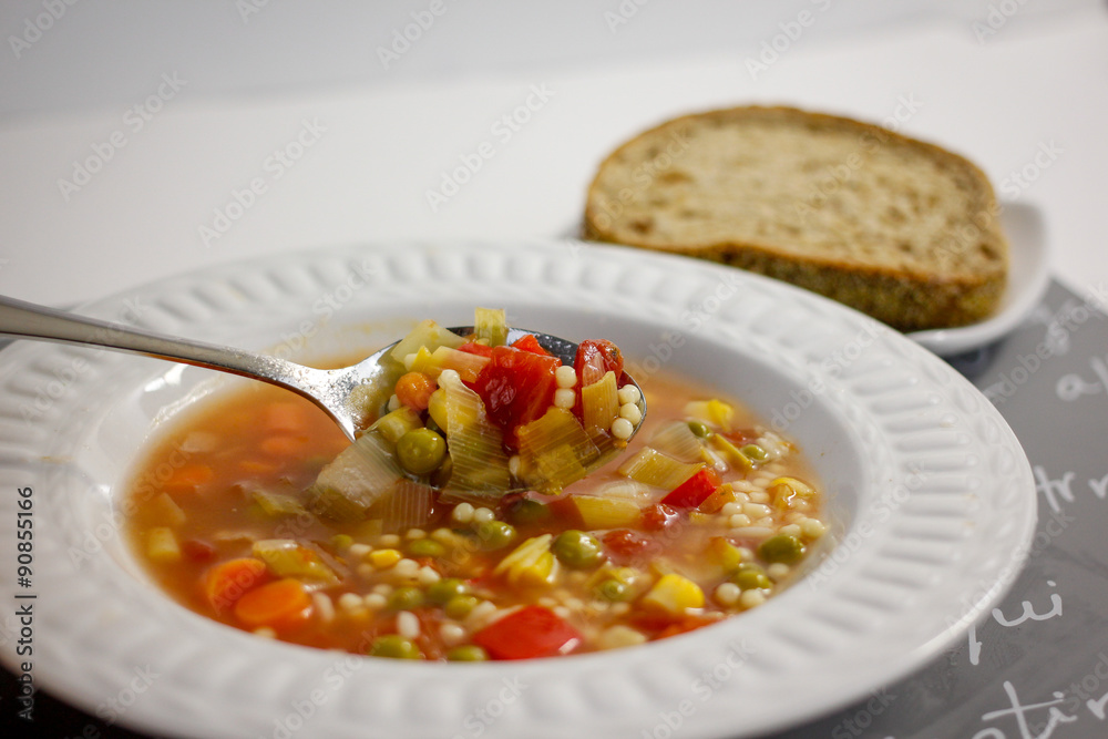 bowl of vegetable soup with bread bowl of vegetable soup with bread