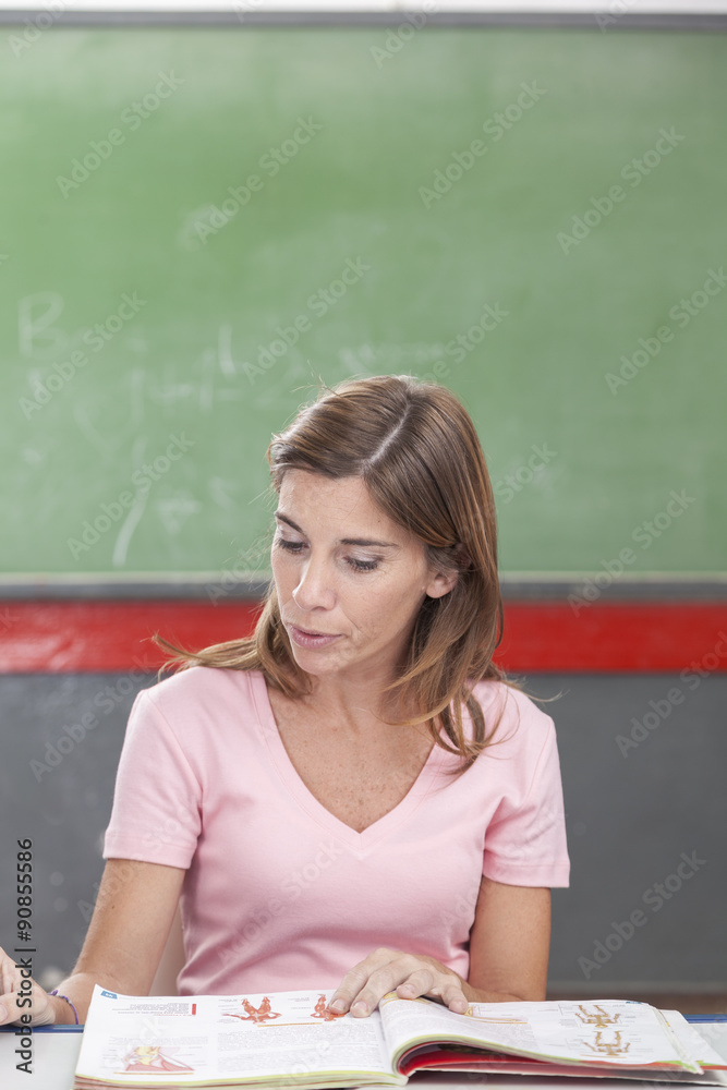The teacher reading a book