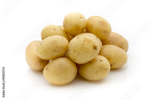 Potatoes on the white background.  New harvest.