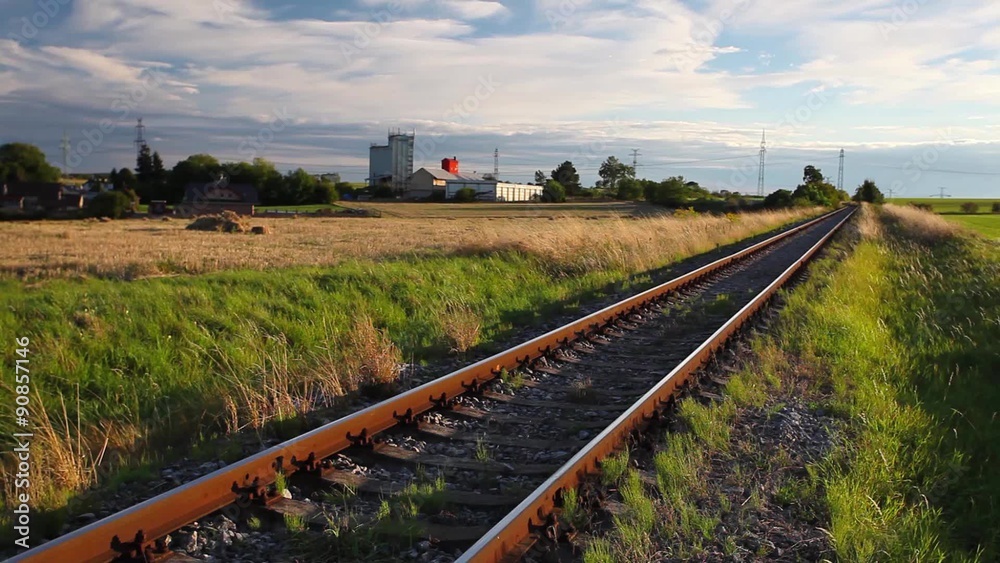Evening on the abandoned railway track at sunset Evening on the abandoned railway track at sunset