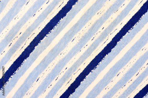 Navy blue striped background. Blue and white stripes pattern on fabric.
