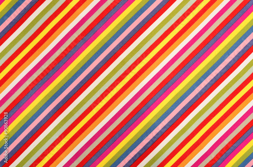 Colorful striped background. All colors diagonal stripes pattern on fabric.