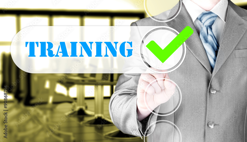 Businessman pressing touch screen interface training checkbox Businessman pressing touch screen interface training checkbox