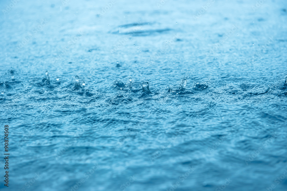 Blue water splash with rain drops background. Natural texture Blue water splash with rain drops background. Natural texture