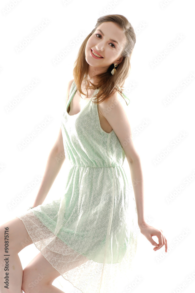 Naklejka premium young woman sitting cube in studio 
