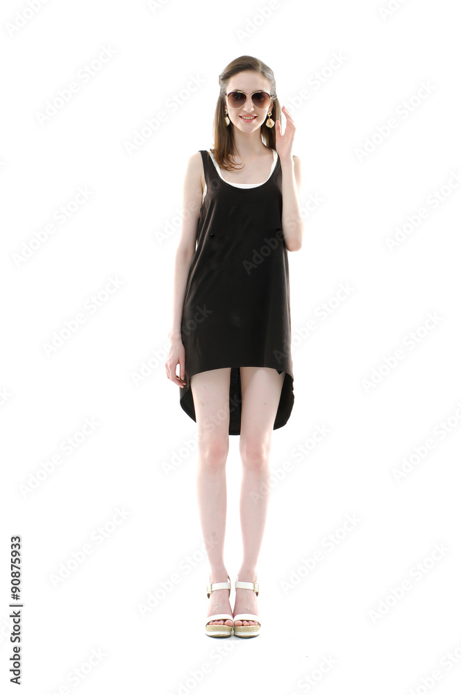 full length Portrait of a beautiful girl in summer dress posing full length Portrait of a beautiful girl in summer dress posing