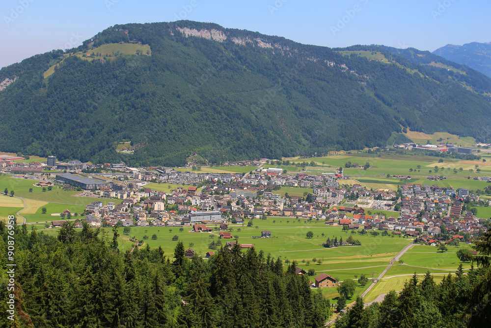 Scenic Alps pastures, town, mountains