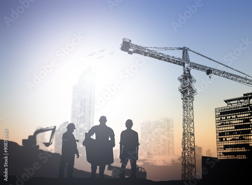 silhouette engineer  in a building site over Blurred constructio