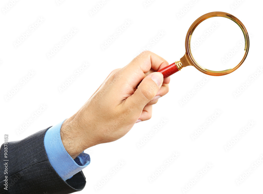 Male hand holding magnifying glass isolated on white Male hand holding magnifying glass isolated on white