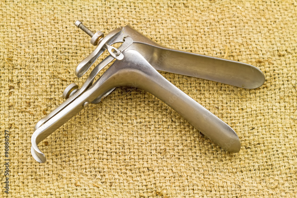 Obraz premium Medical equipment ,Gynecologic Speculum on brown sack fabric background