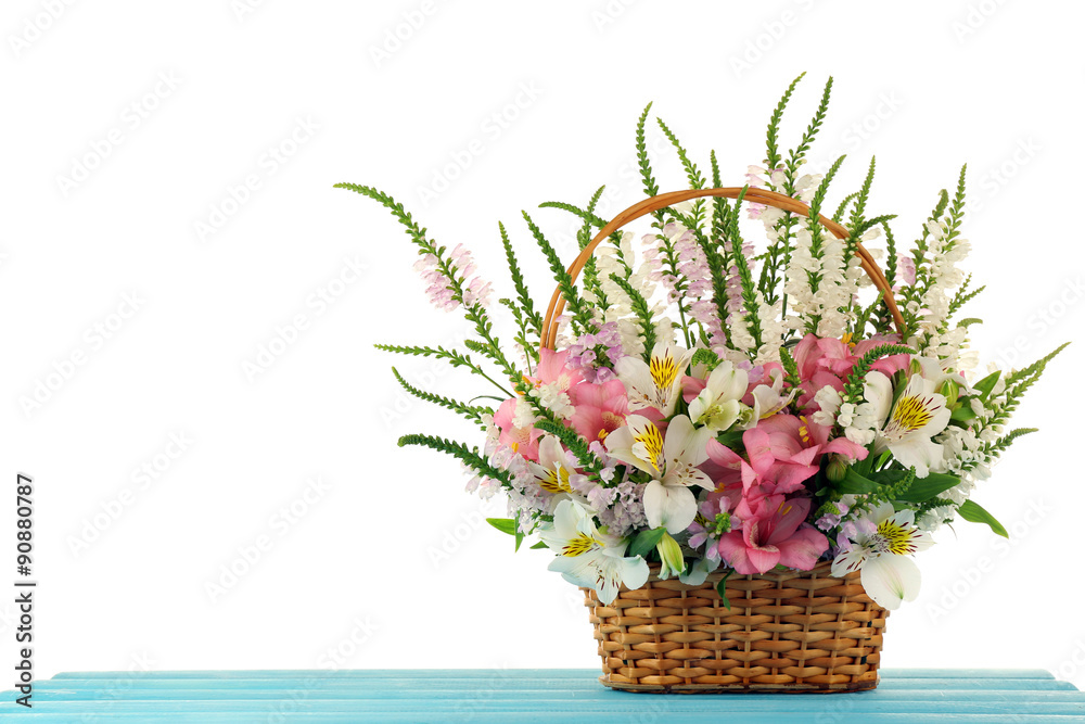 Beautiful floral arrangement in basket isolated on white