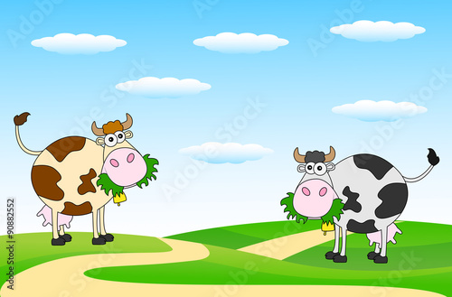 spotted cows grazing in a meadow