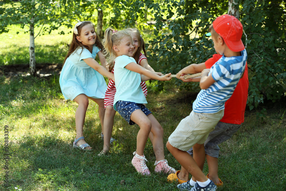 Fototapeta premium Happy active children playing in park