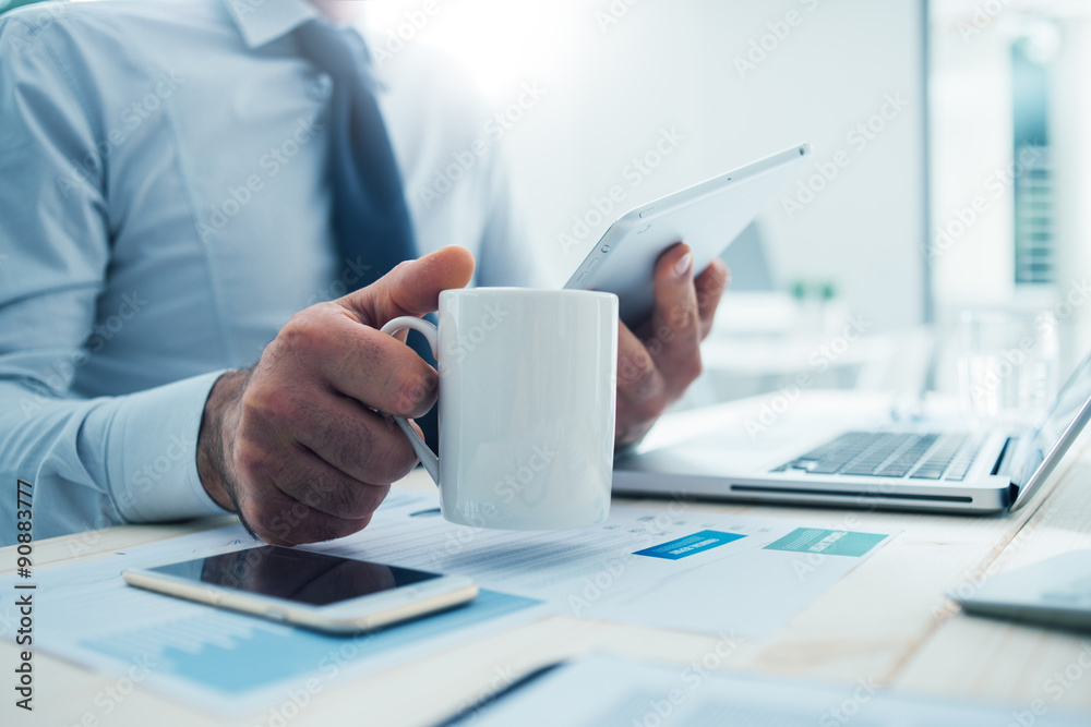 Businessman having a coffee break Businessman having a coffee break