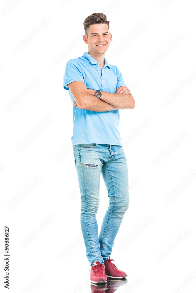 casual young man standing with his hands crossed. casual young man standing with his hands crossed.