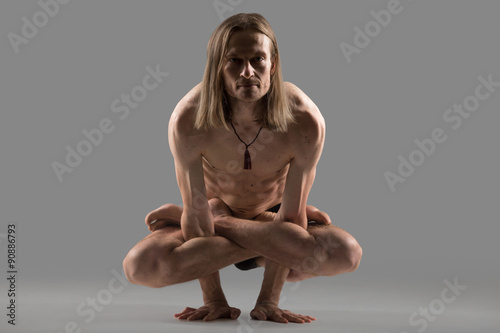 Kukkutasana posture photo