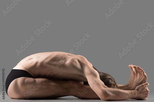 Paschimottanasana yoga posture photo