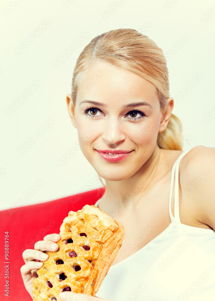 Portrait of young happy smiling woman with pie at home Portrait of young happy smiling woman with pie at home