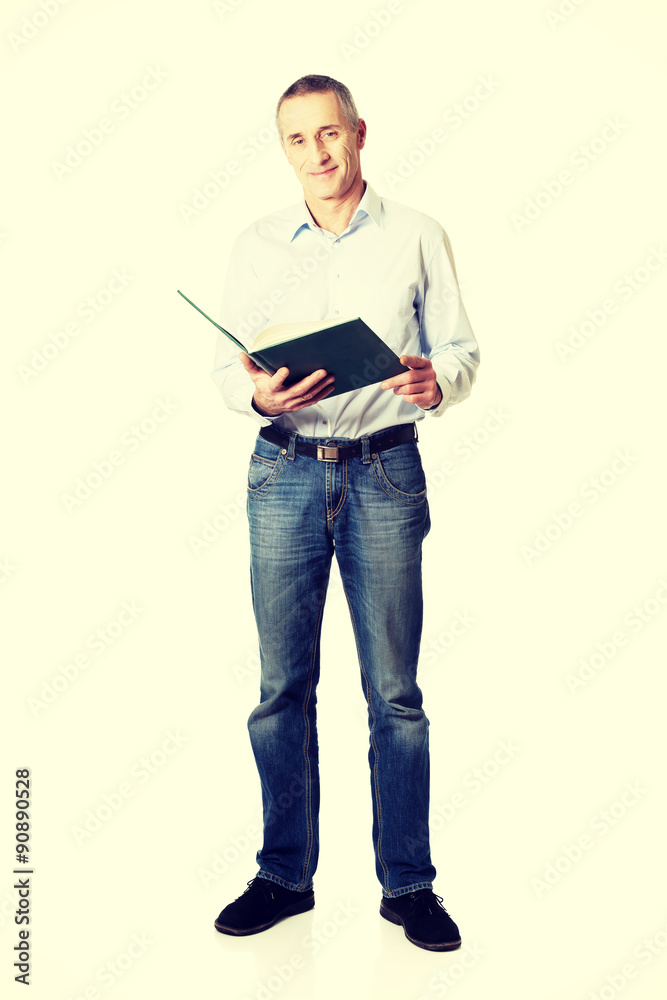 Handsome man reading his schedule