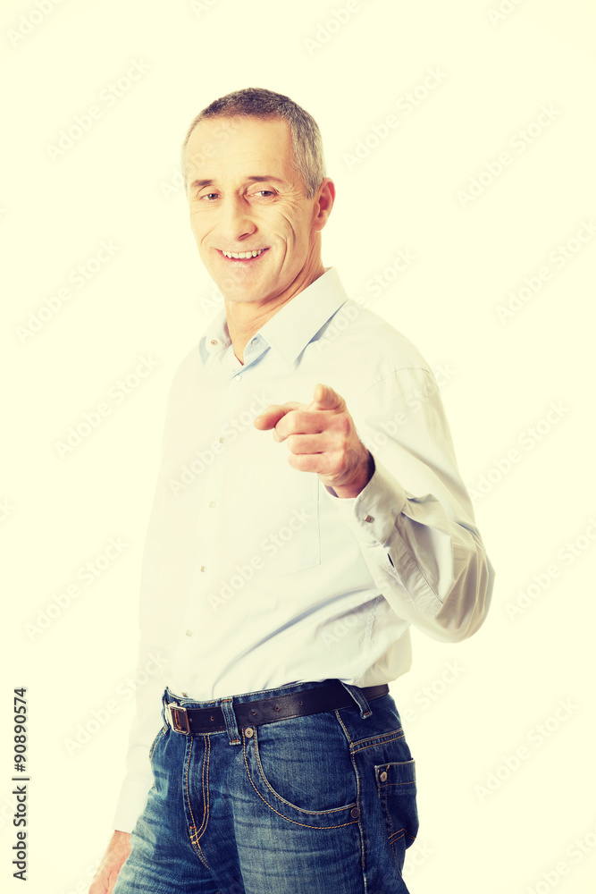 Happy handsome man pointing at you Happy handsome man pointing at you