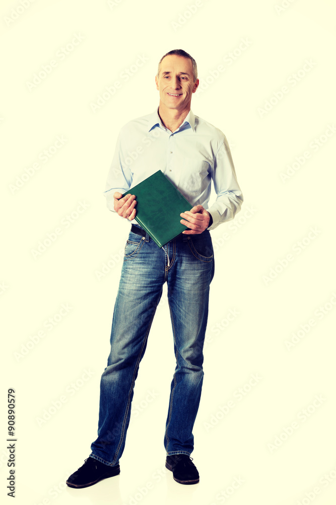 Fototapeta premium Handsome man holding his calendar