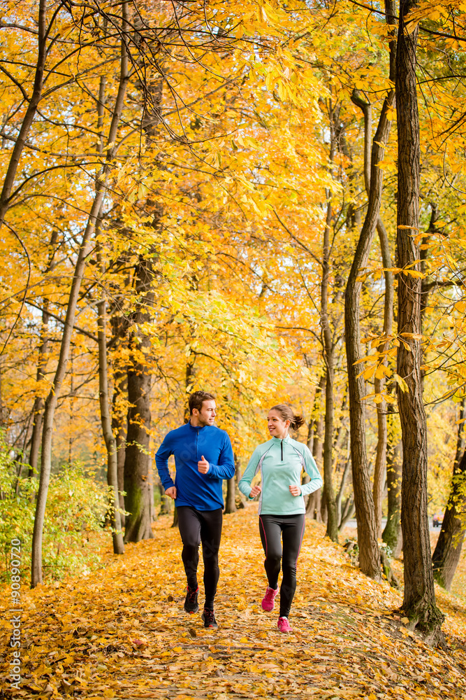 Young people jogging together in nature Young people jogging together in nature