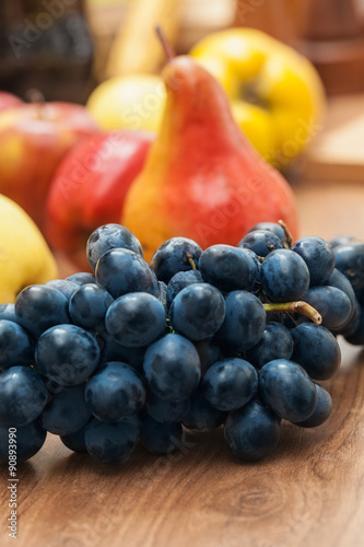 Fruit on old plank  grape  pears and apples