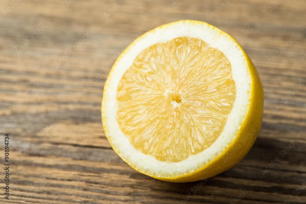Fresh and juicy lemon on wooden table Fresh and juicy lemon on wooden table