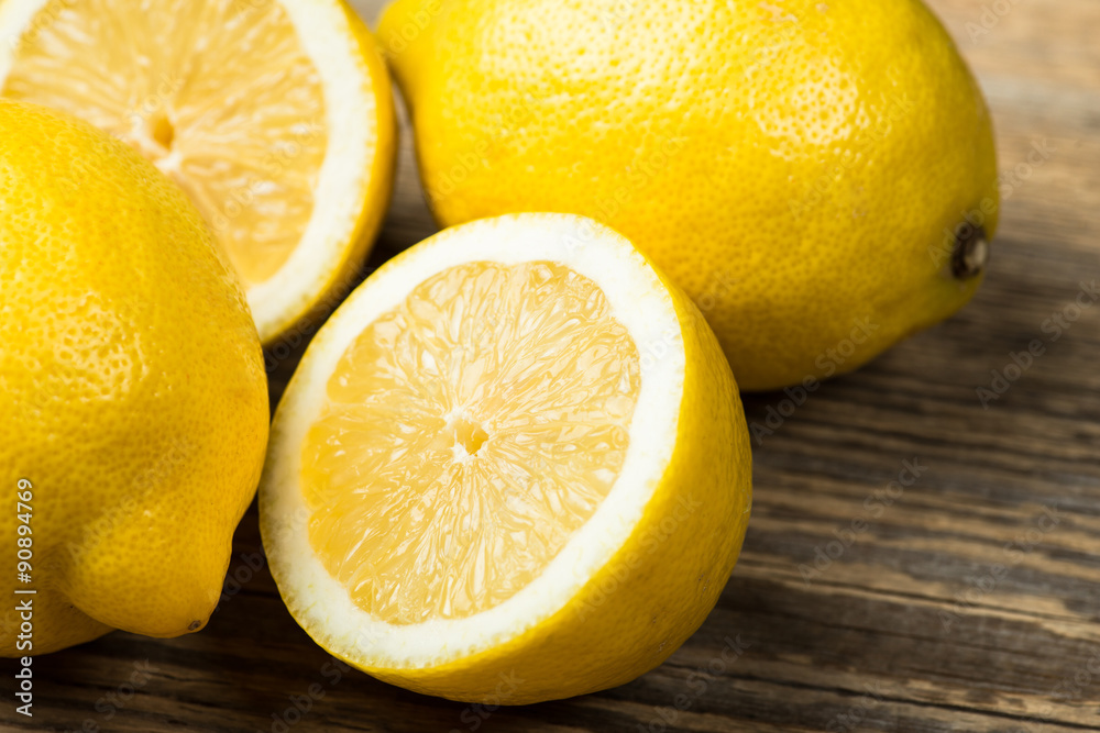 Several fresh and juicy lemons on wooden table Several fresh and juicy lemons on wooden table