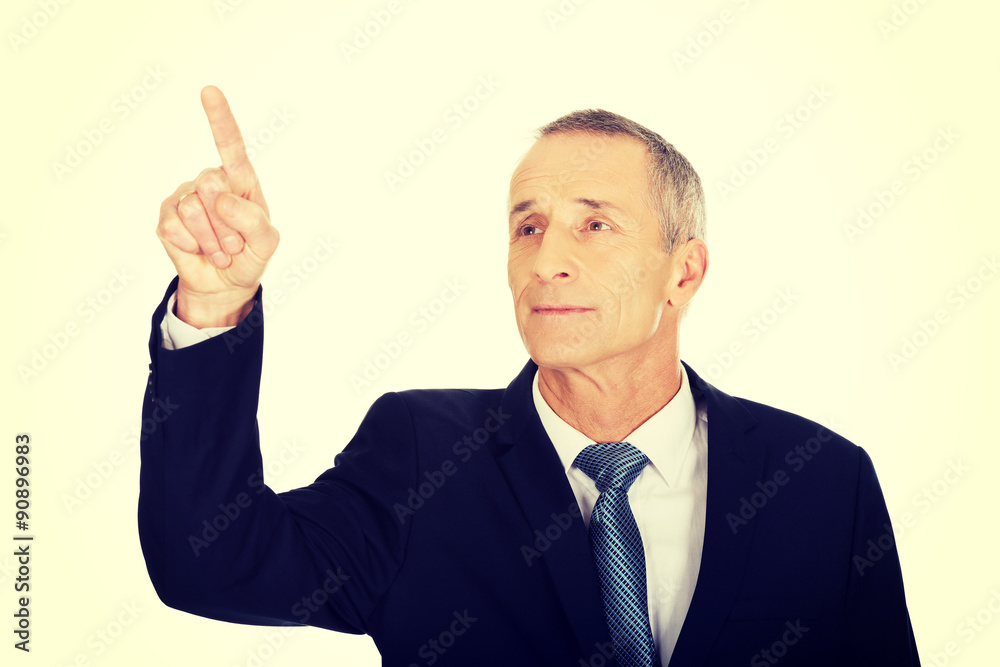Businessman pressing abstract button Businessman pressing abstract button
