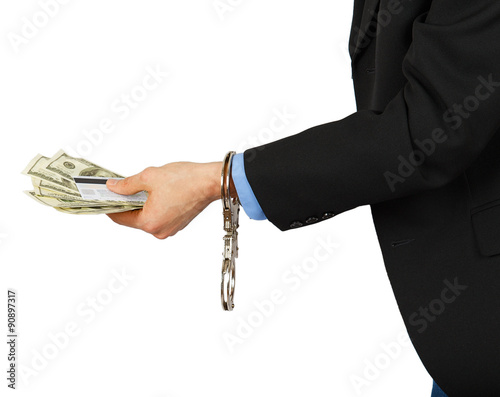 Man in a black suit with dollars and a card in the hands with ha photo