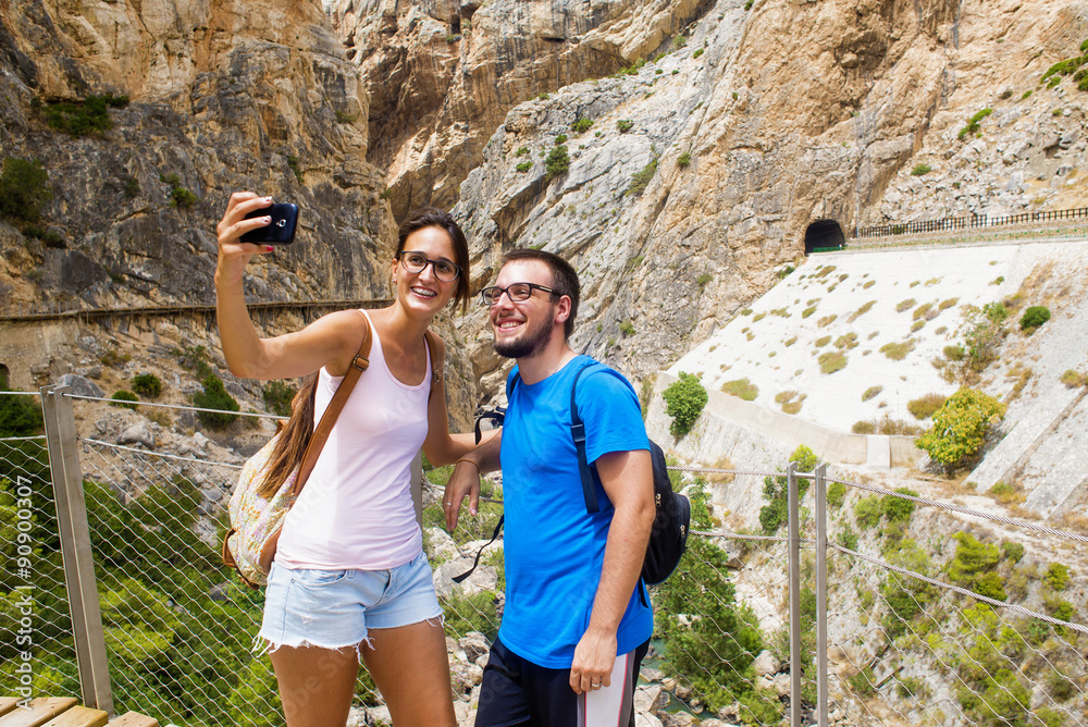 Young couple taking a selfie in mountainous place