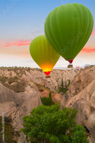 Hot air balloons sunset Hot air balloon flying mountain valley Göreme National Park and the Rock Sites of Cappadocia Turkey
