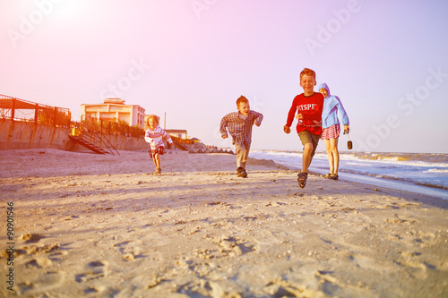 kids on the sea beach photo