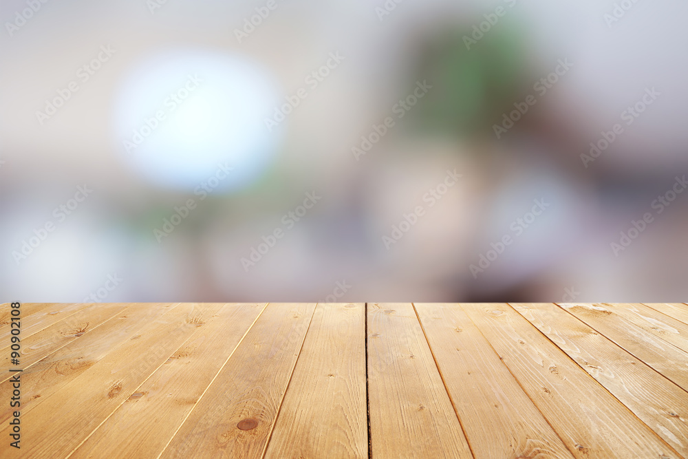 Wooden table with abstract blur background Wooden table with abstract blur background