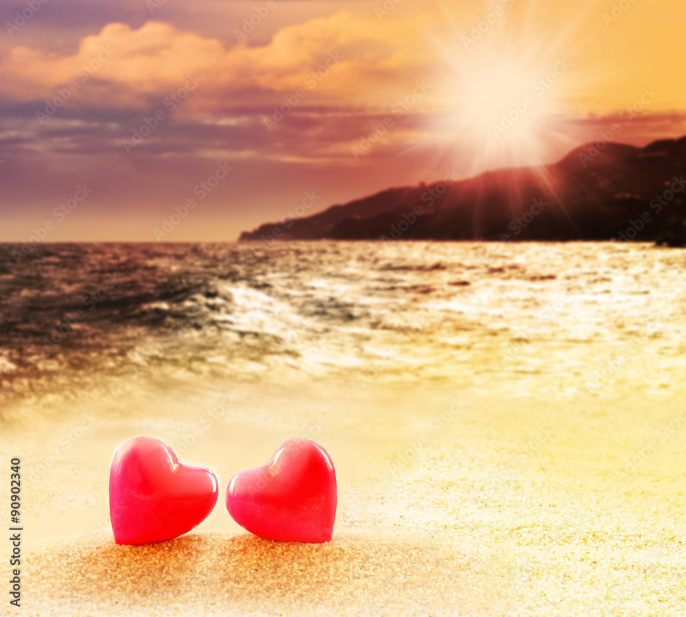 Fototapeta premium Hearts on summer sunset beach
