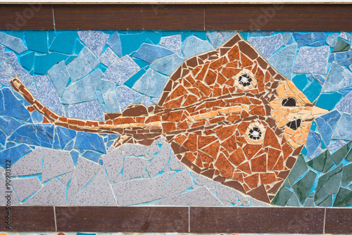 Abstract crampfish made of colorful mosaic tiles in the street of Budva, Montenegro. photo