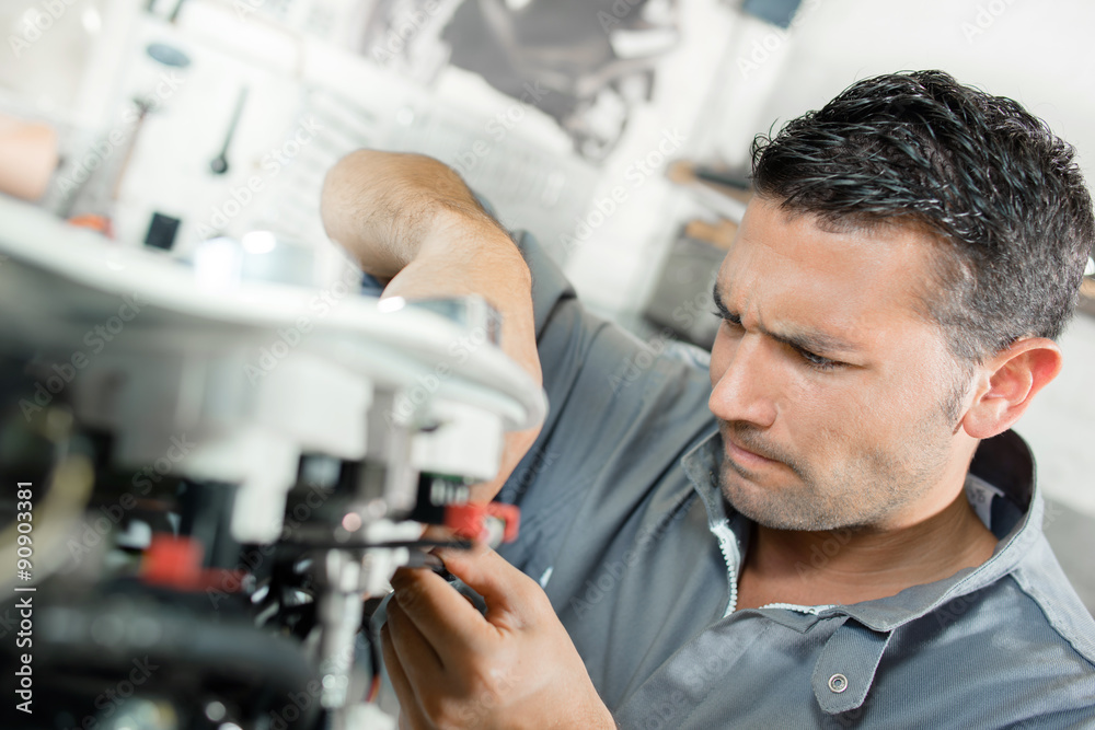 Man using machinery Man using machinery