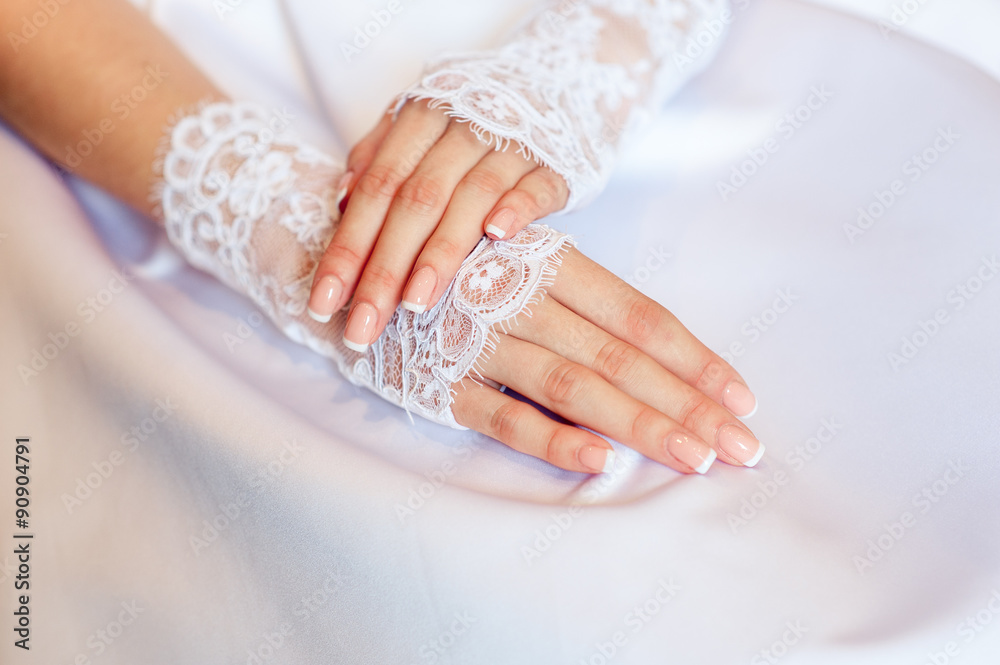 hands of a bride with a wedding manicure hands of a bride with a wedding manicure