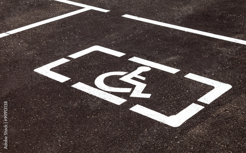 Parking places with handicapped or disabled signs and marking li