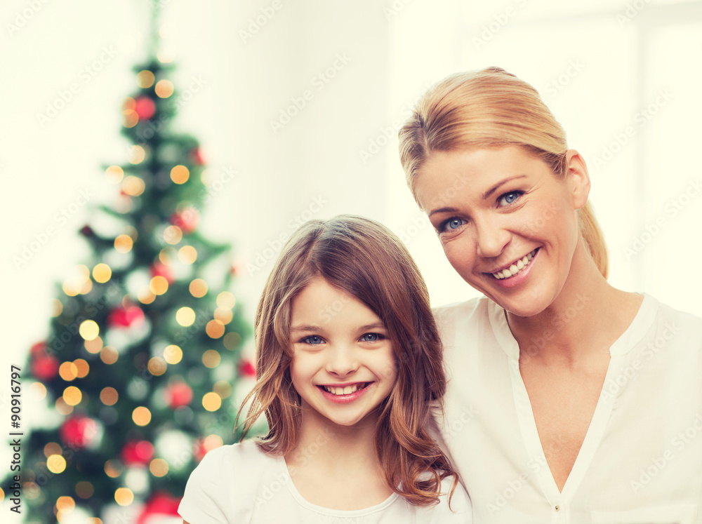 smiling mother and little girl