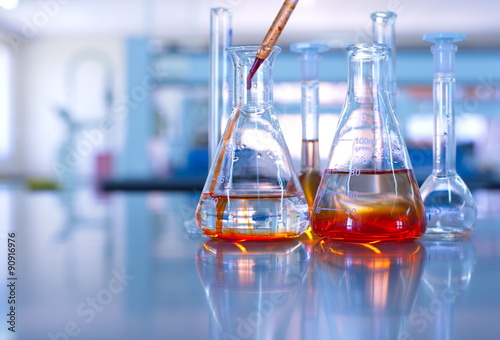 science laboratory glassware orange solution