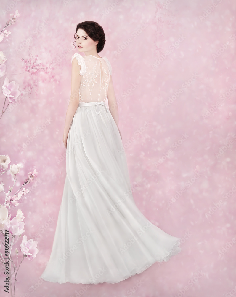 Bride dancing in romantic studio - white flowers, snow falling Bride dancing in romantic studio - white flowers, snow falling