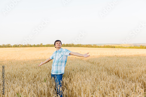 man on wheat field © producer